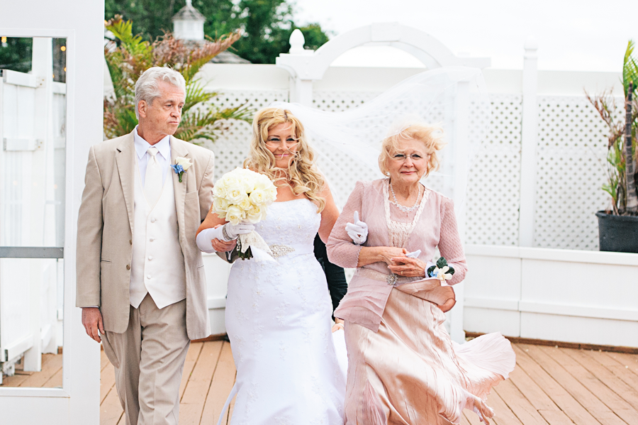 Mother and Father walking the Bride down the aisle