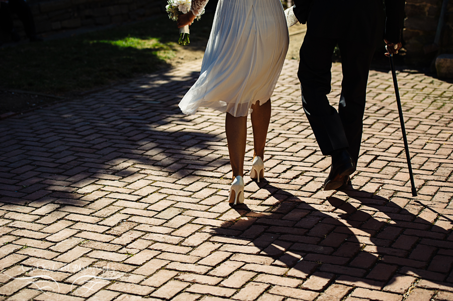 bride and groom walking hand in hand in georgetown washington dc