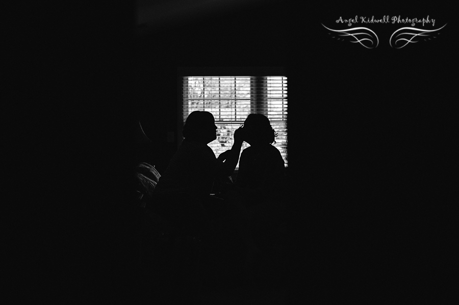 bride putting makeup on her bridesmaid in annapolis maryland