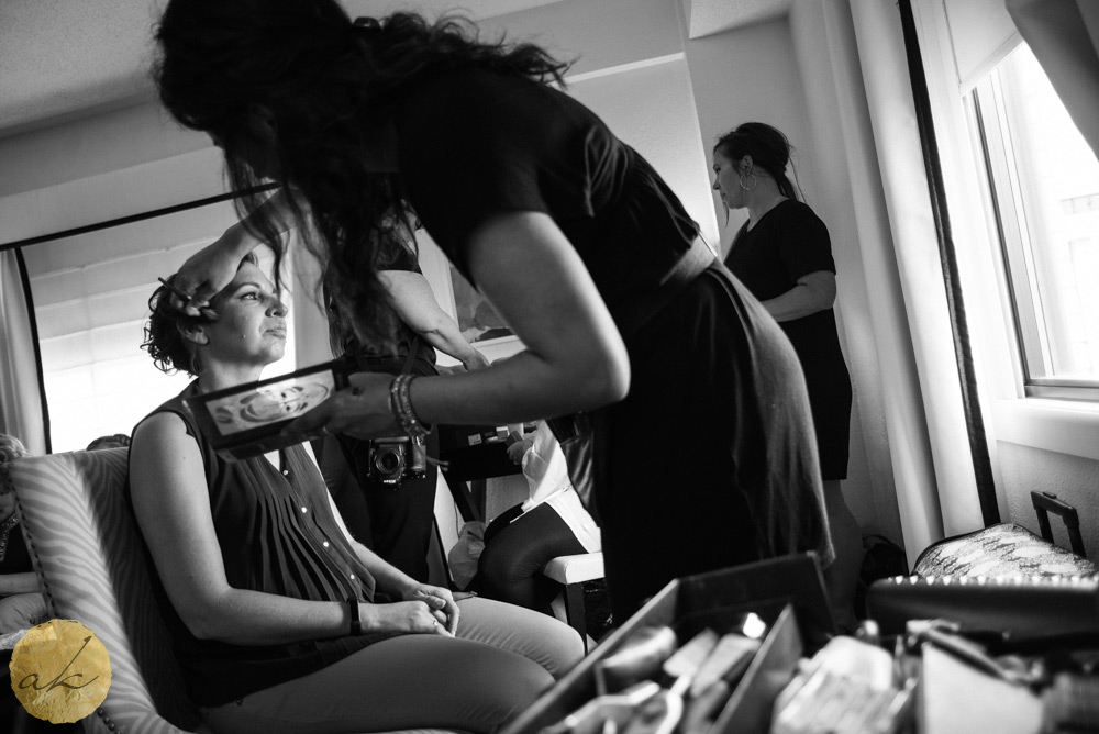 bridesmaid getting makeup done at Sunset room National harbor wedding