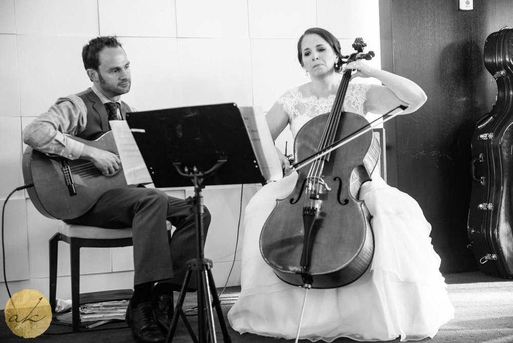 bride playing her cello at Sunset room National harbor wedding