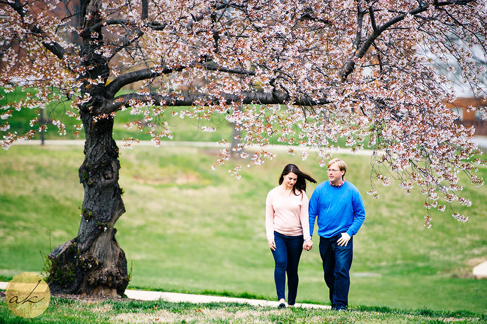 baltimore spring engagement photo couple walking holding hands