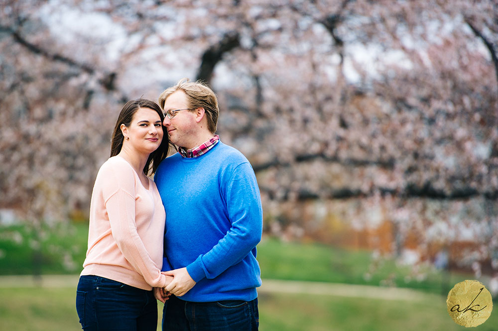 maryland spring engagement photos man snuggling into womans cheek