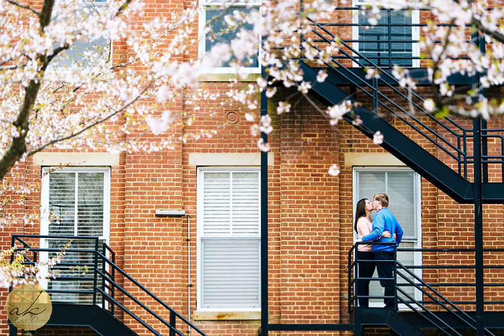 university of maryland college park engagement session couple kissing on fire escape stairs