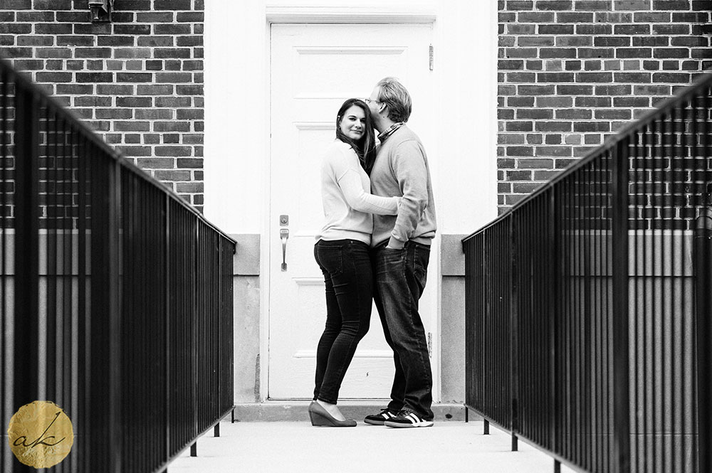 college park engagement session man kissing women on head