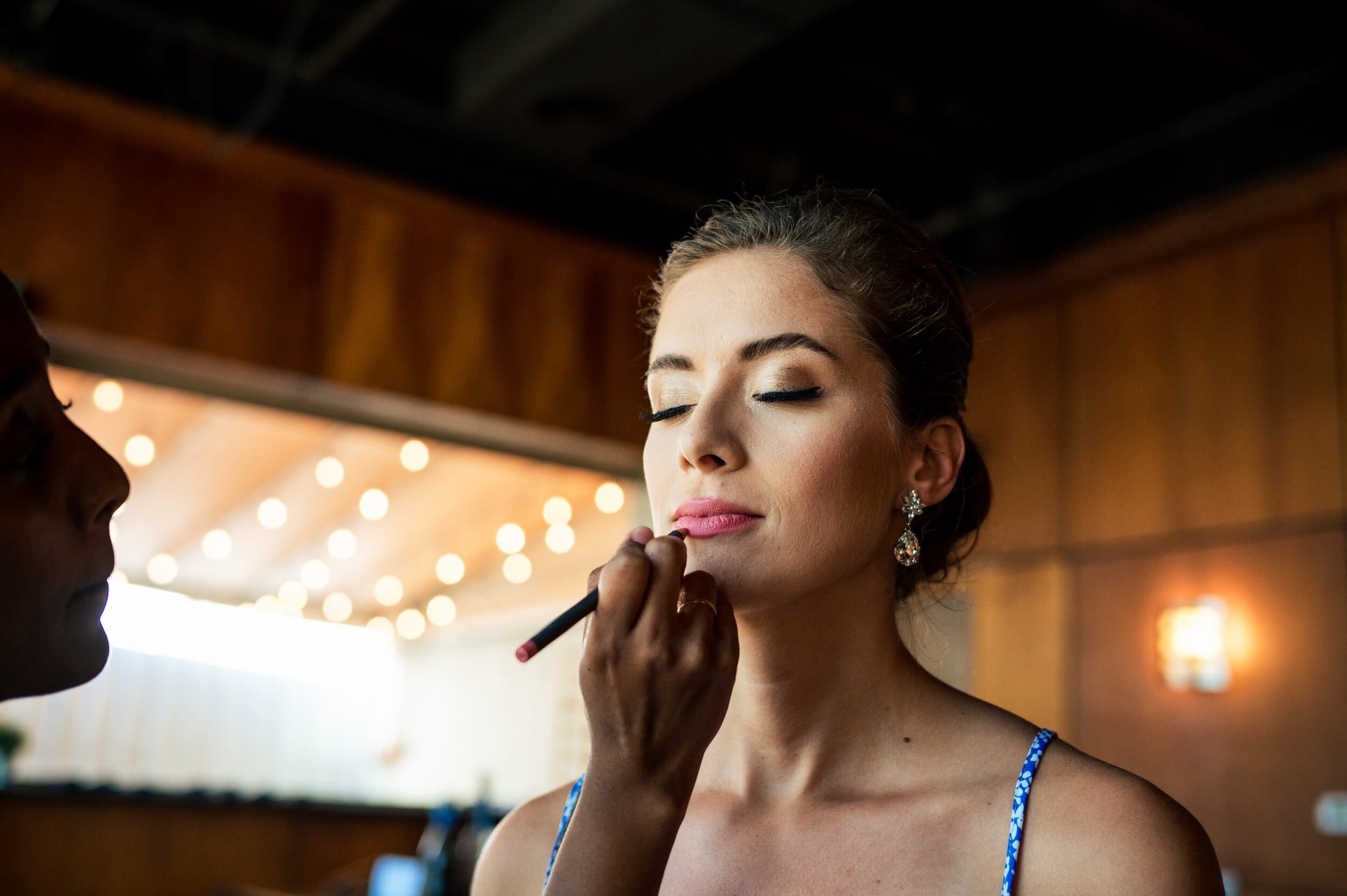 bride putting lipstick on at dc winery wedding venue