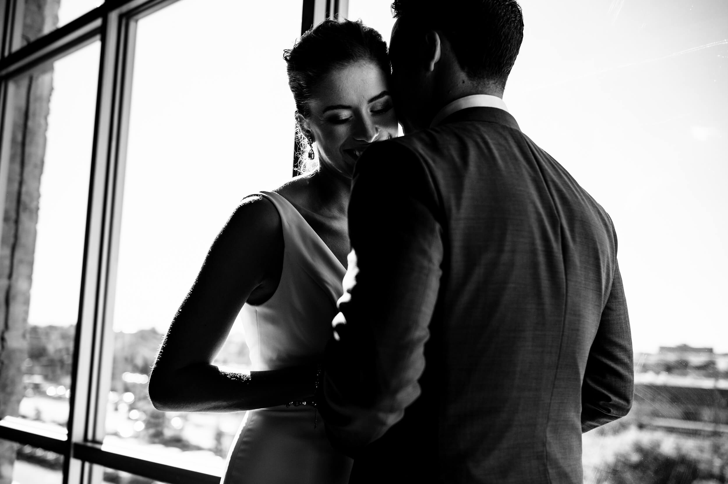 groom kissing his bride on the cheek in washington dc