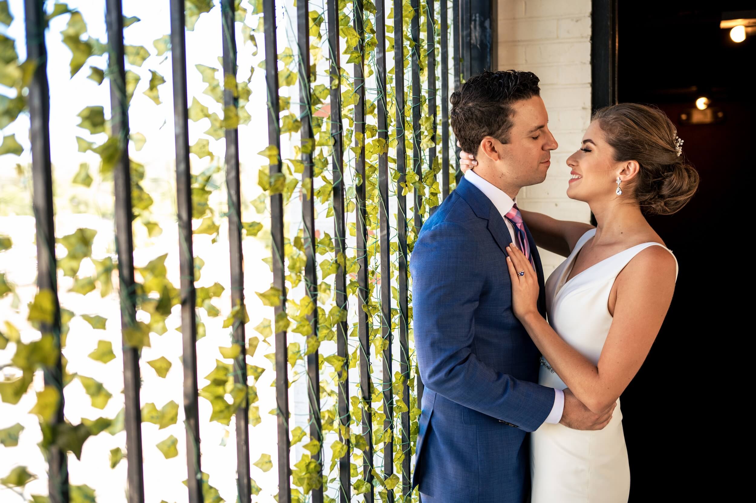 couple embracing in front of dc wedding venue