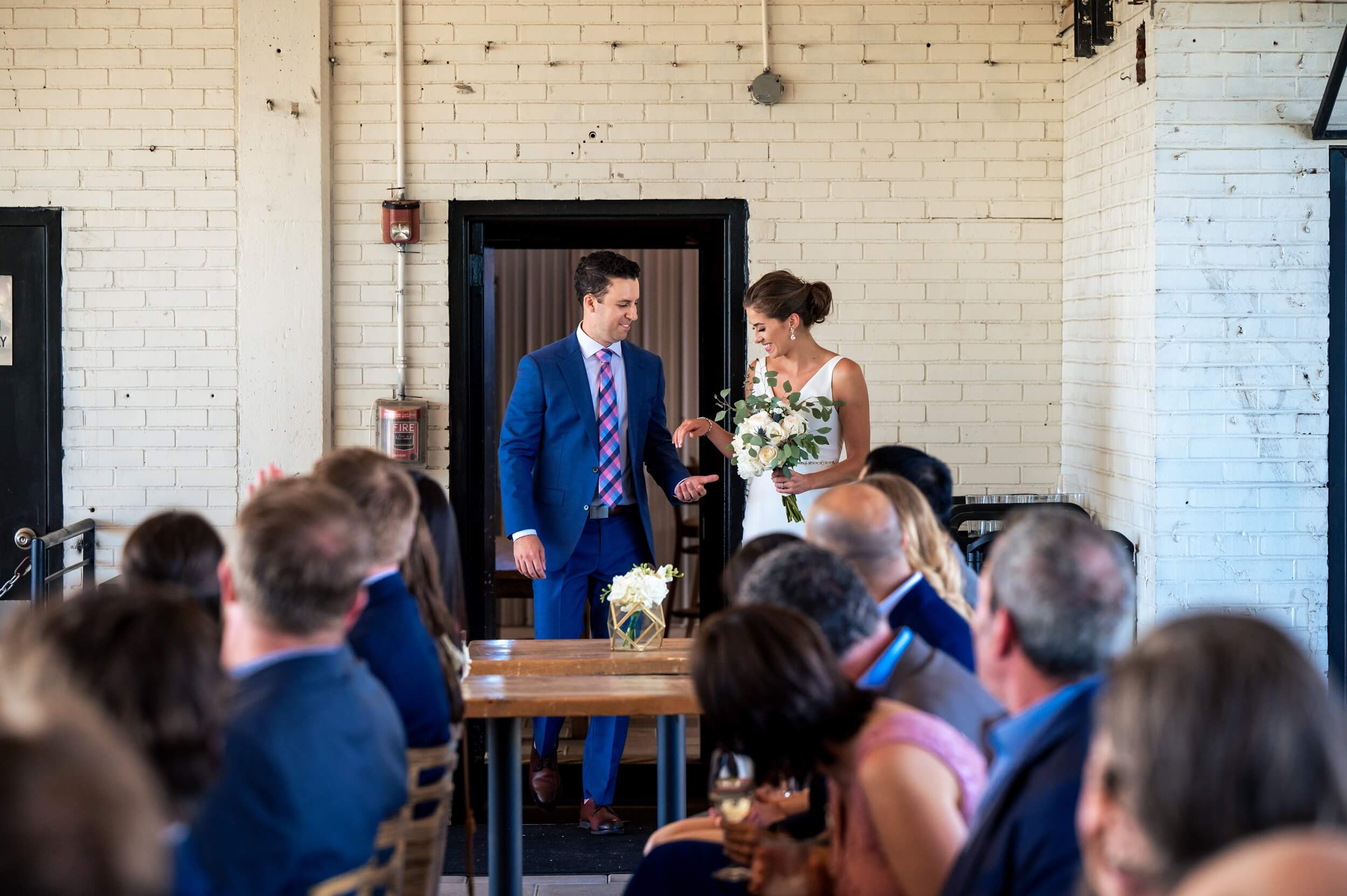 bride and groom enter the room for ceremony at dc winery