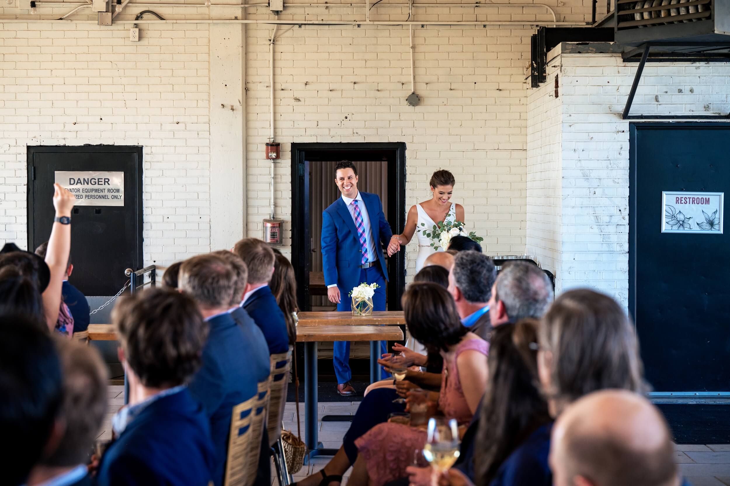 bride and groom enter the room for ceremony at dc winery