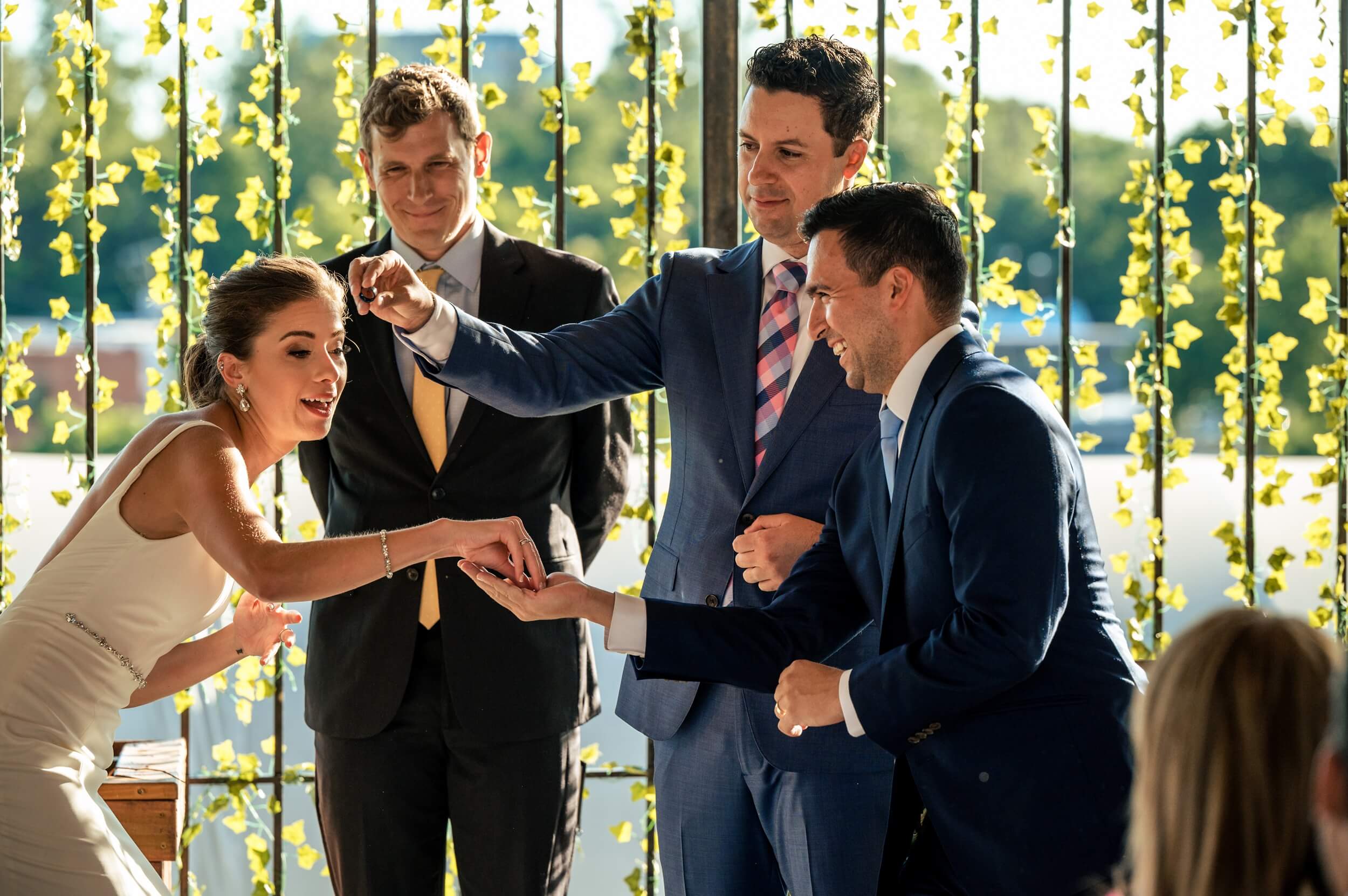 bride and groom exchange rings during ceremony at winery wedding venue in washington dc