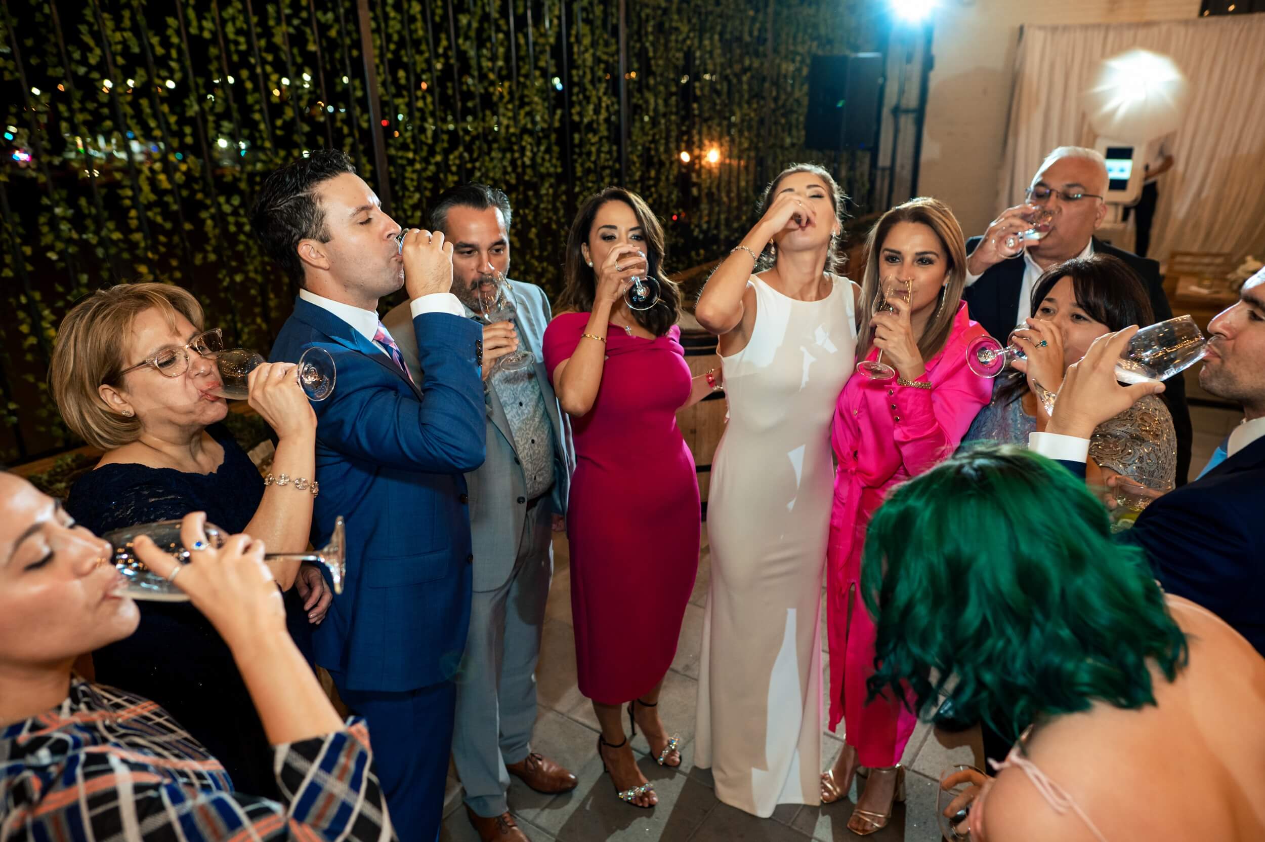 group of friends drinking shots during reception of dc wedding
