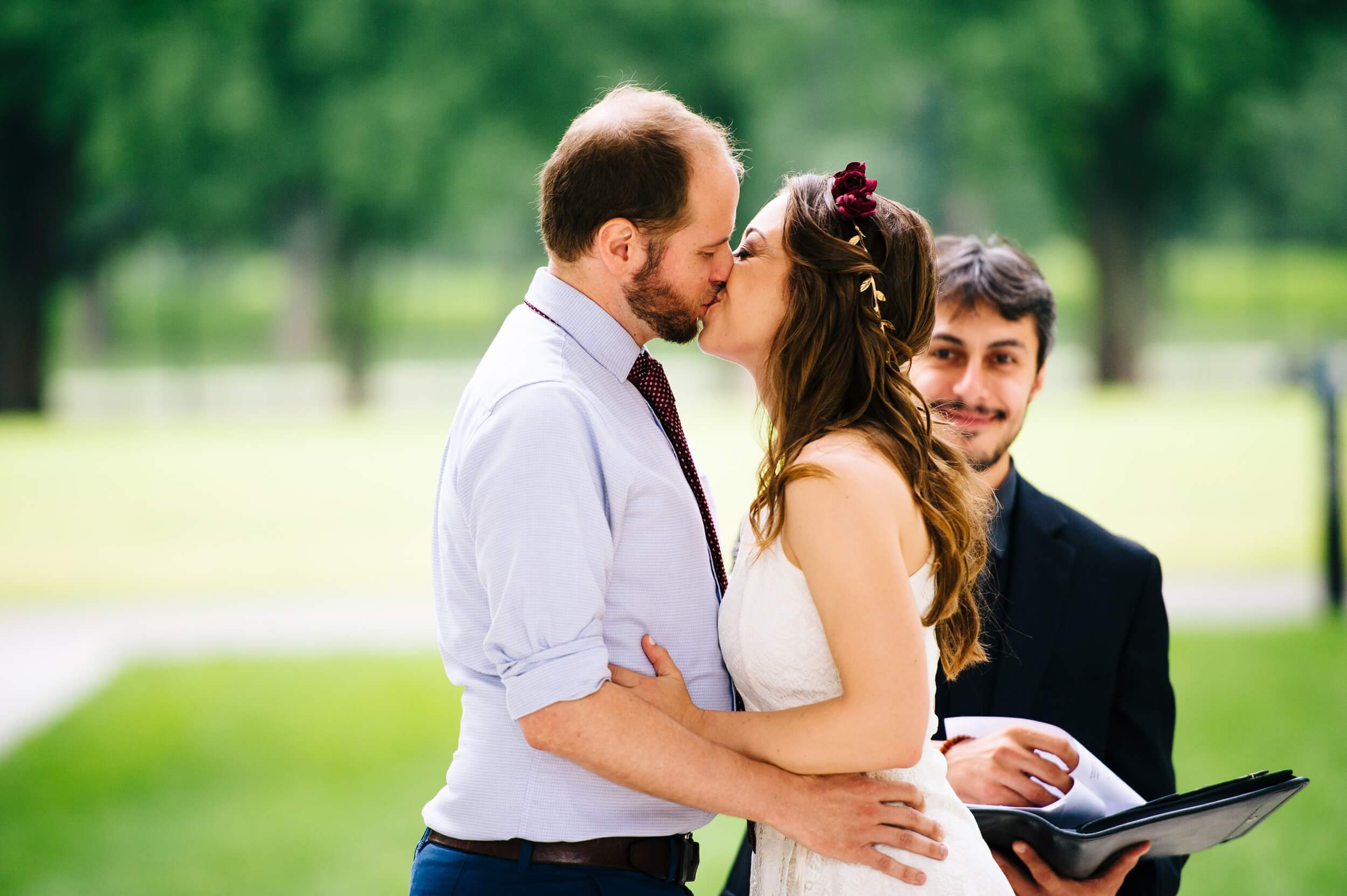 just married couple sharing first kiss