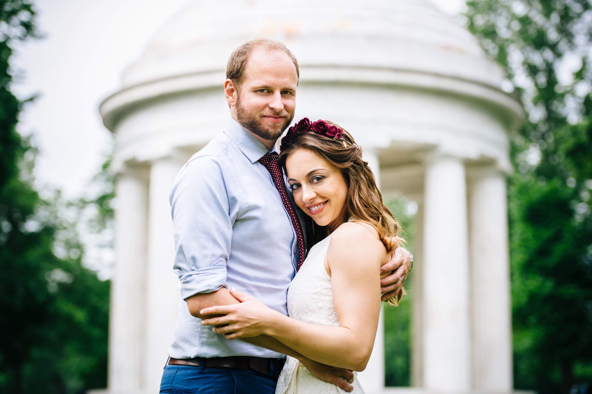 couple smiling standing in front of the dc war memorial after intimate spring ceremony